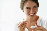 woman holding contact lenses case